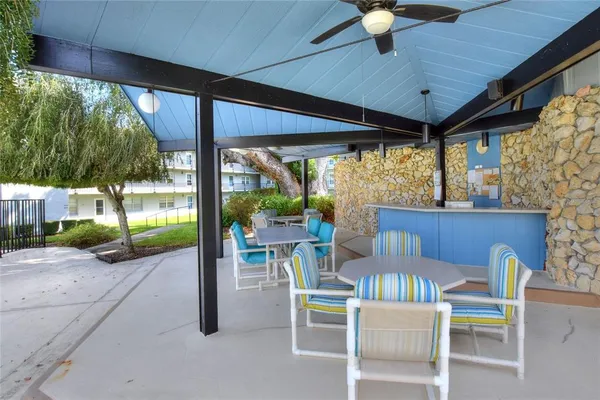 a view of a patio with swimming pool