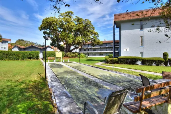 a flower garden is sitting in front of the house