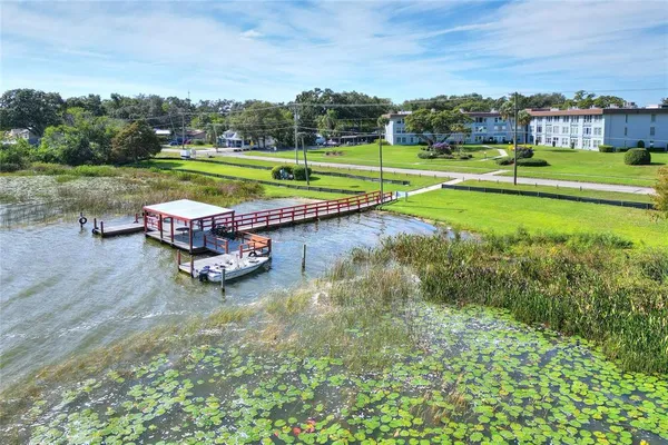 a swimming pool with a yard of the back yard