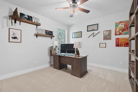 a workspace with furniture and window
