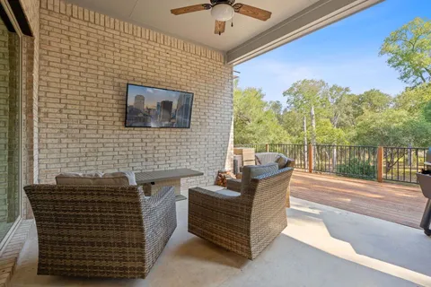 a balcony with furniture and a potted plant