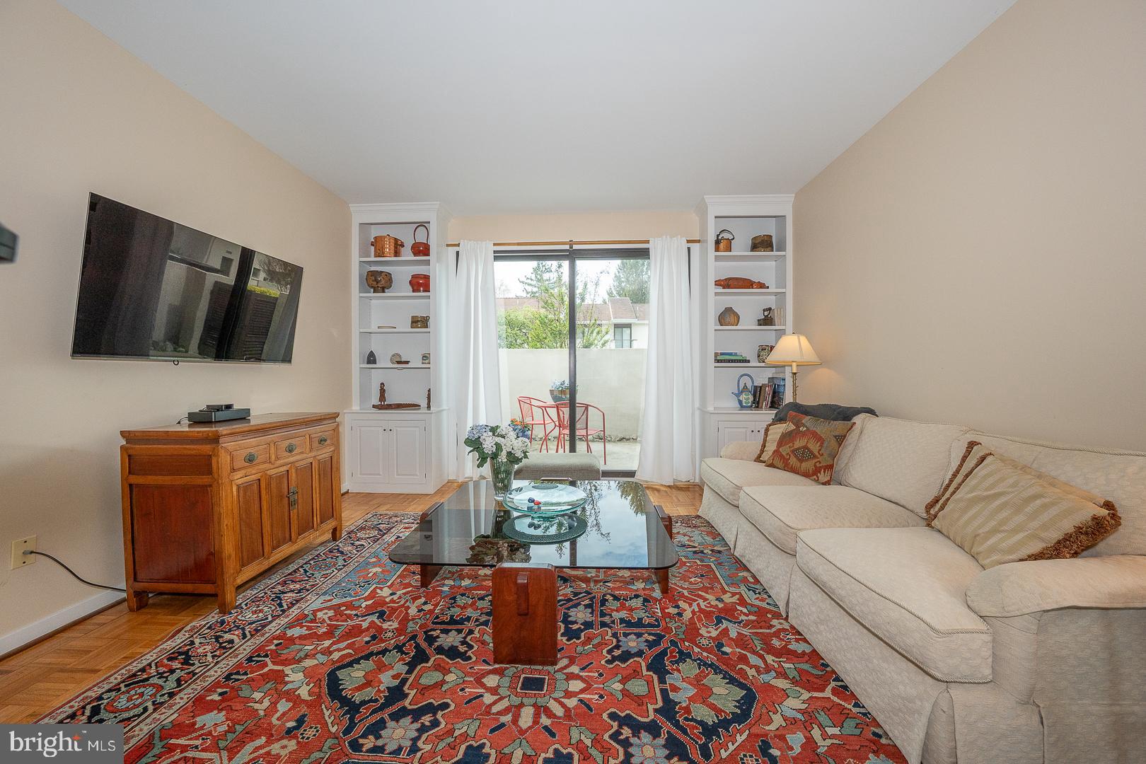 10 Brettagne, Unit 10 Devon, PA 19333 - Photo 18 of 46 a living room with furniture and a flat screen tv