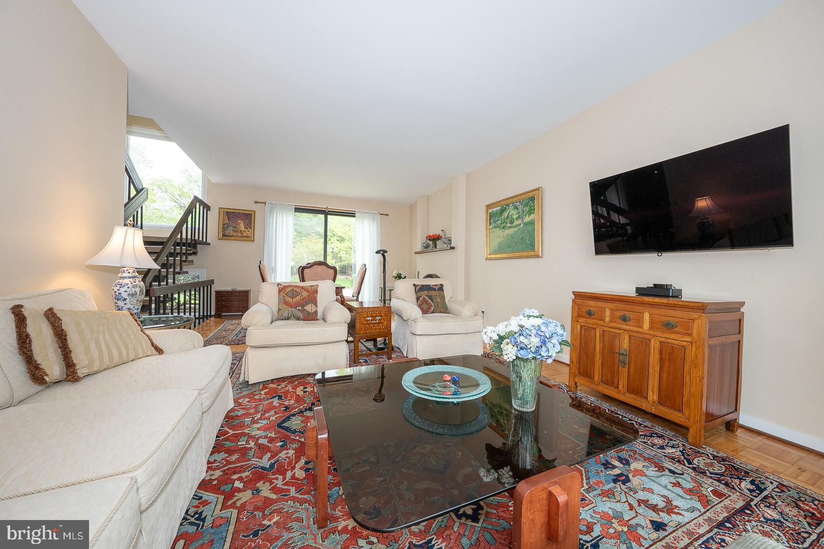 10 Brettagne, Unit 10 Devon, PA 19333 - Photo 19 of 46 a living room with furniture and a flat screen tv