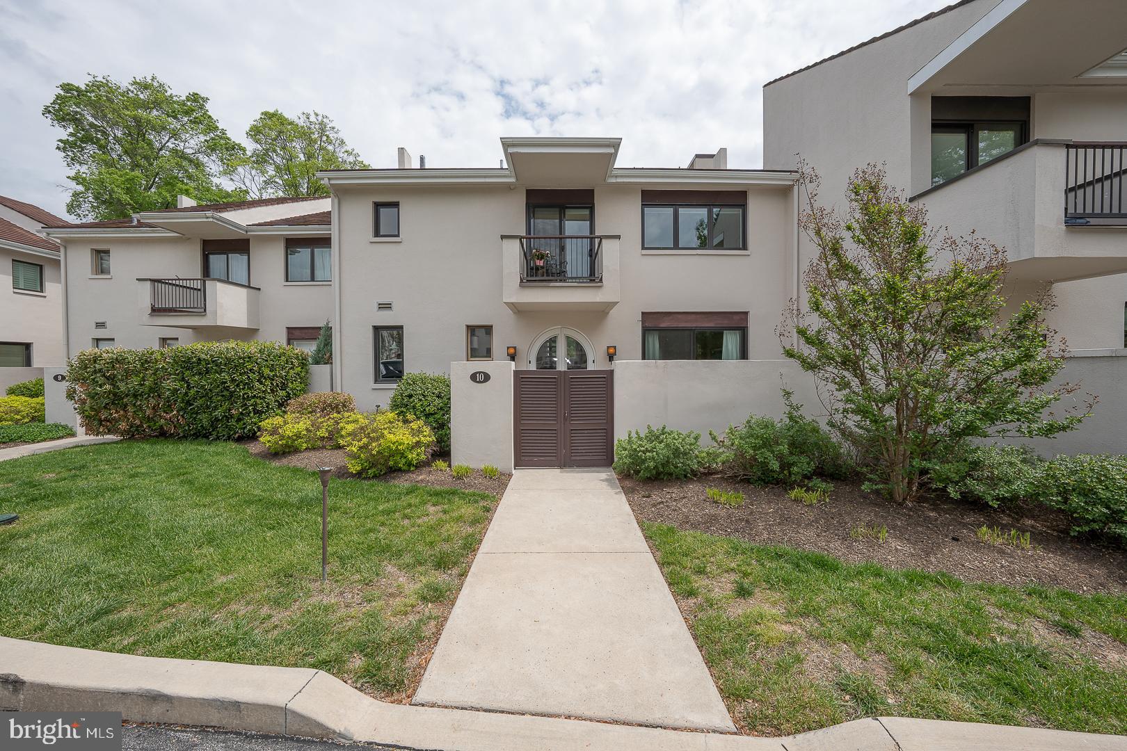 10 Brettagne, Unit 10 Devon, PA 19333 - Photo 2 of 46 a front view of a house with garden
