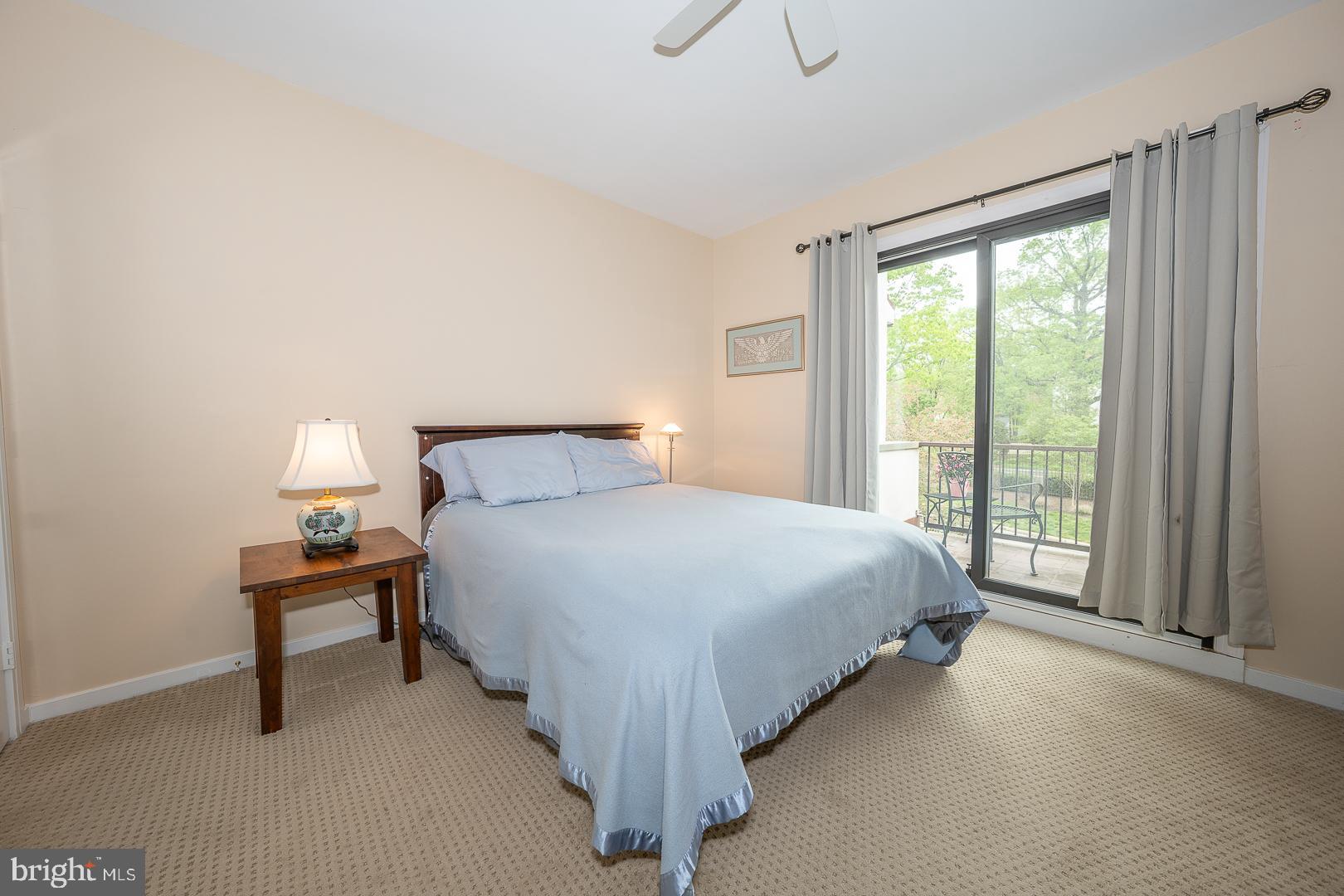 10 Brettagne, Unit 10 Devon, PA 19333 - Photo 25 of 46 a bed sitting in a bedroom next to a window