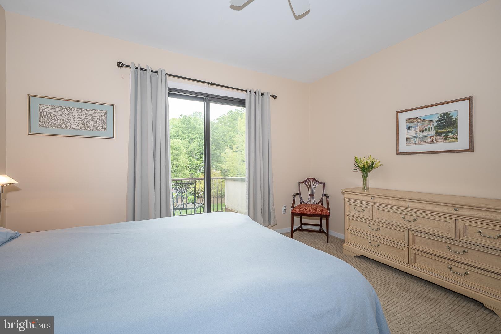 10 Brettagne, Unit 10 Devon, PA 19333 - Photo 27 of 46 a bedroom with a bed and wooden floor