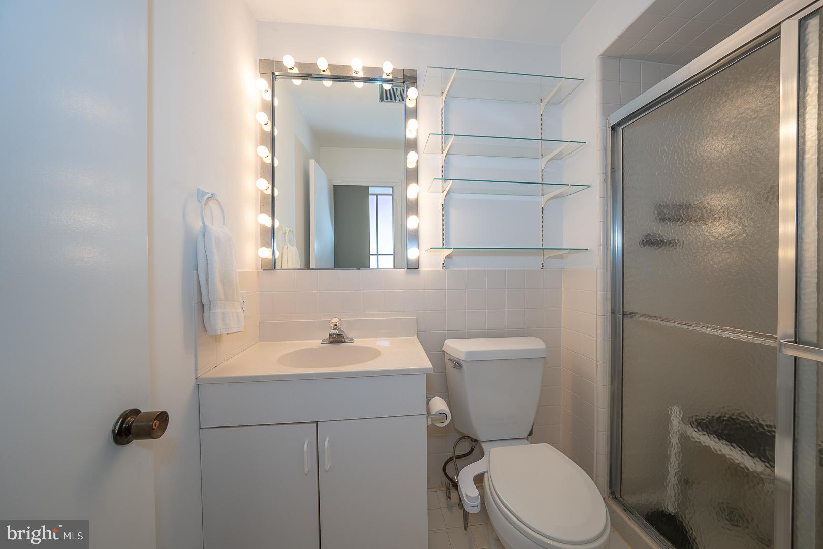 10 Brettagne, Unit 10 Devon, PA 19333 - Photo 28 of 46 a bathroom with a toilet a sink and shower