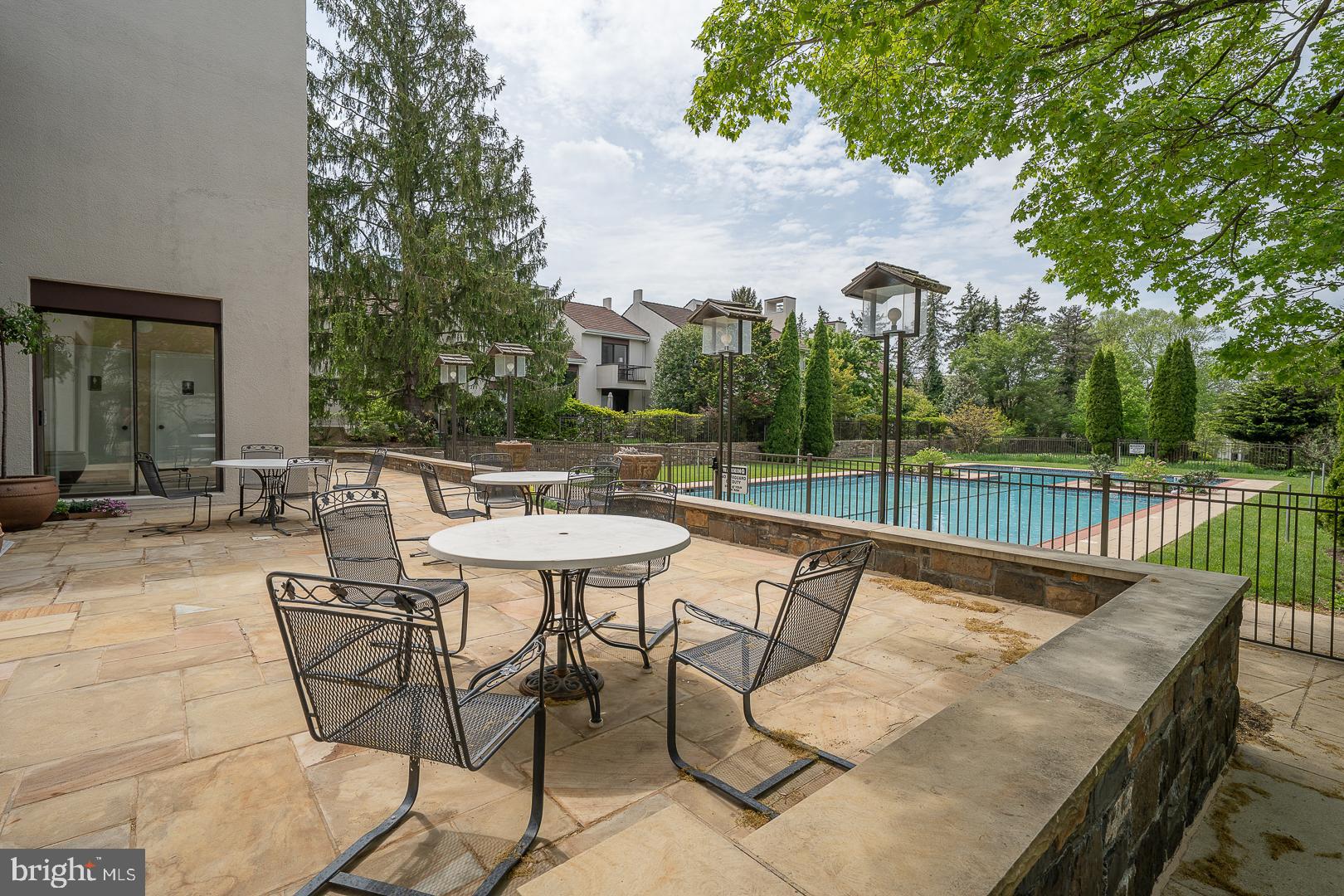 10 Brettagne, Unit 10 Devon, PA 19333 - Photo 43 of 46 swimming pool view with a seating space