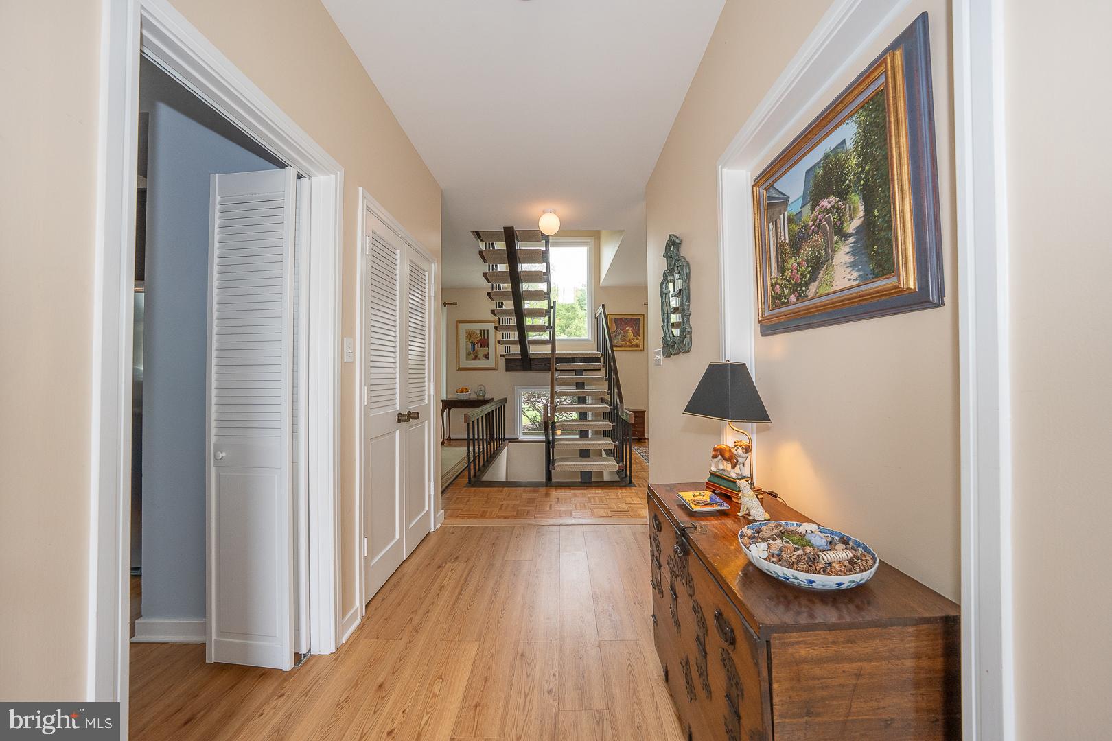 10 Brettagne, Unit 10 Devon, PA 19333 - Photo 6 of 46 a hallway with furniture and wooden floor