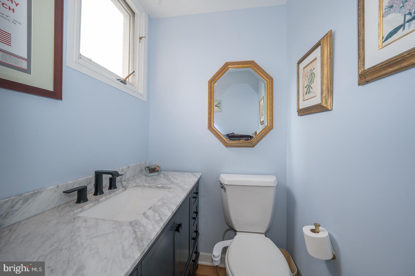 10 Brettagne, Unit 10 Devon, PA 19333 - Photo 8 of 46 a bathroom with a toilet a sink and a mirror