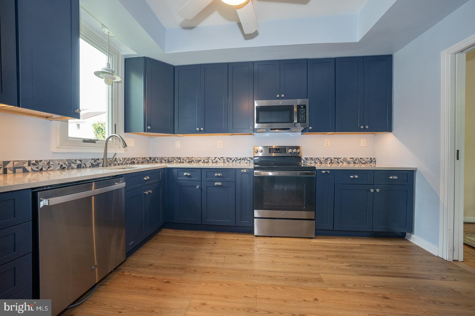10 Brettagne, Unit 10 Devon, PA 19333 - Photo 9 of 46 a kitchen with granite countertop a stove and a sink