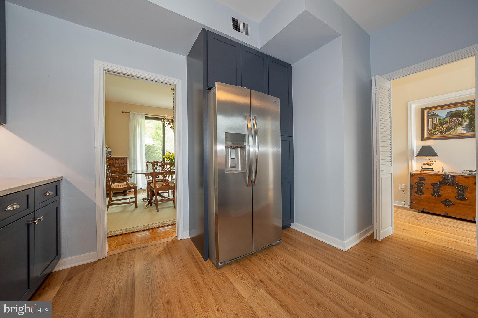 10 Brettagne, Unit 10 Devon, PA 19333 - Photo 10 of 46 a view of a livingroom kitchen and dining room with wooden floor