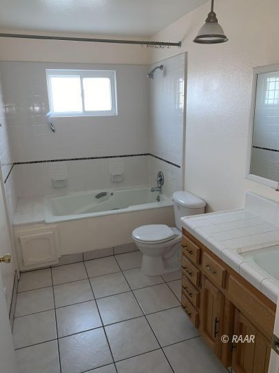 600 South Nevada Street Ridgecrest, CA 93555 - Photo 23 of 30 a bathroom with a sink a toilet and shower