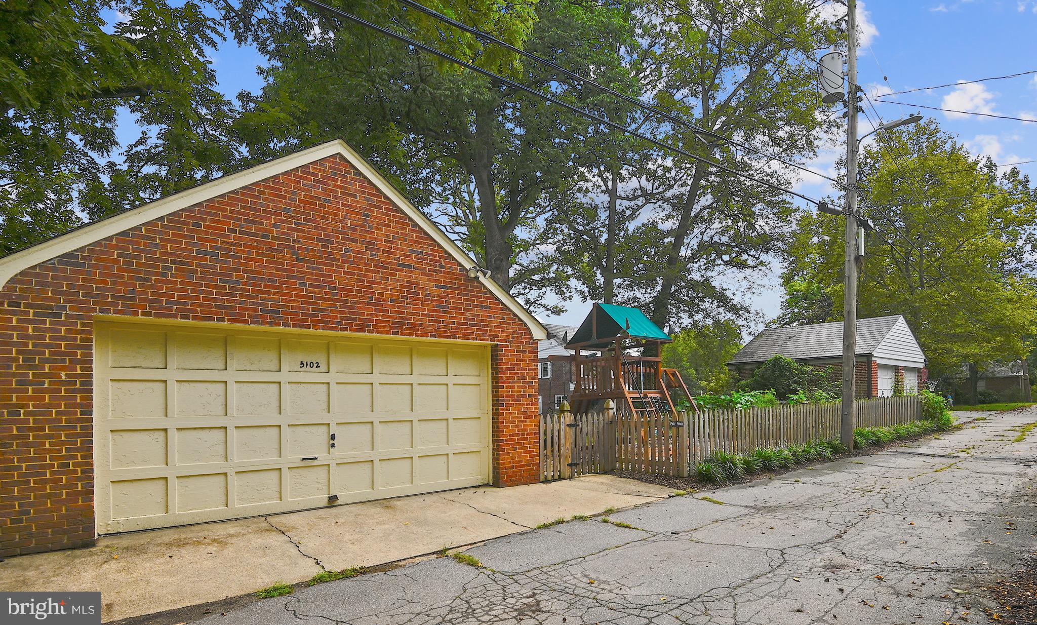 5102 Springlake Way Baltimore, MD 21212 - Photo 34 of 38 Large detached garage and fenced yard