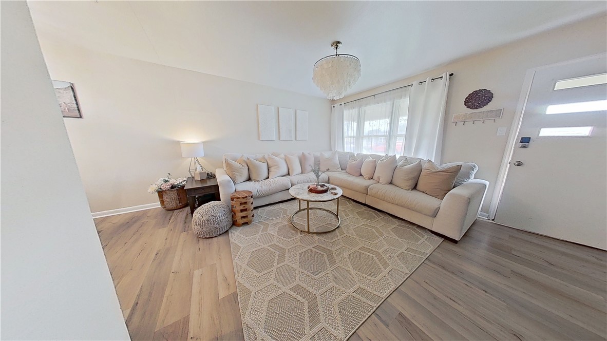 4805 Alice Street Corpus Christi, TX 78411 - Photo 2 of 19 a living room with furniture and a large window