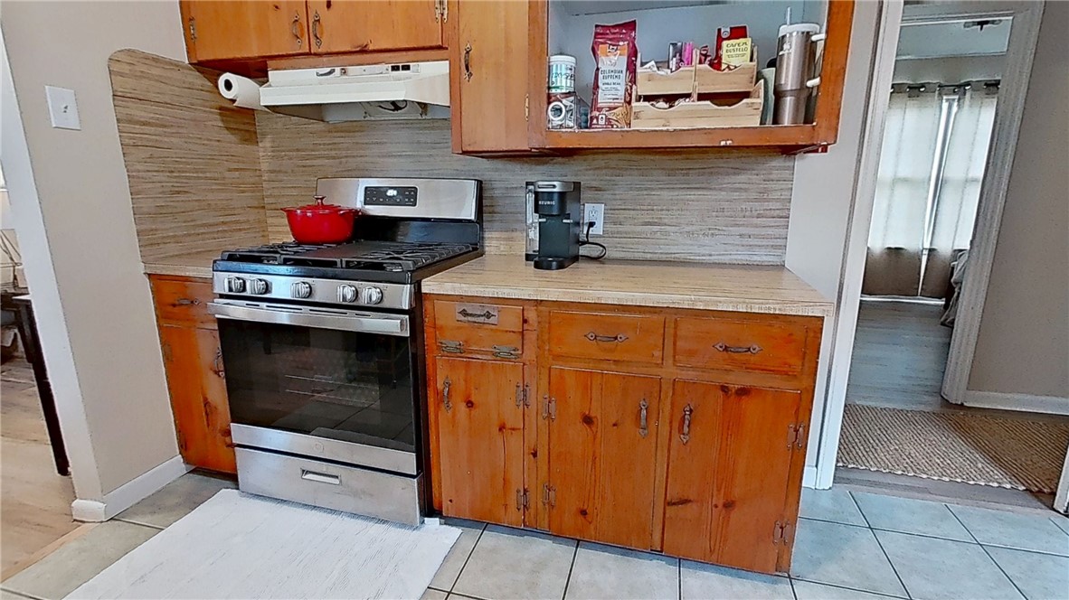 4805 Alice Street Corpus Christi, TX 78411 - Photo 6 of 19 a kitchen with stainless steel appliances granite countertop a stove and a refrigerator