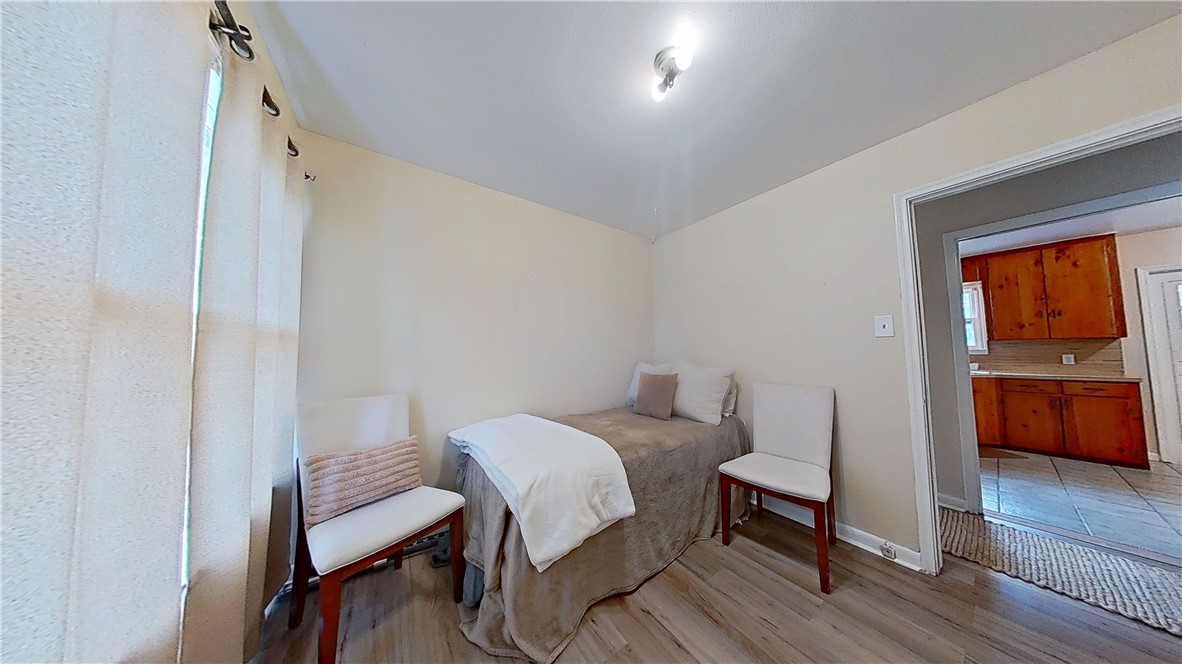 4805 Alice Street Corpus Christi, TX 78411 - Photo 10 of 19 a bedroom with a bed and a table