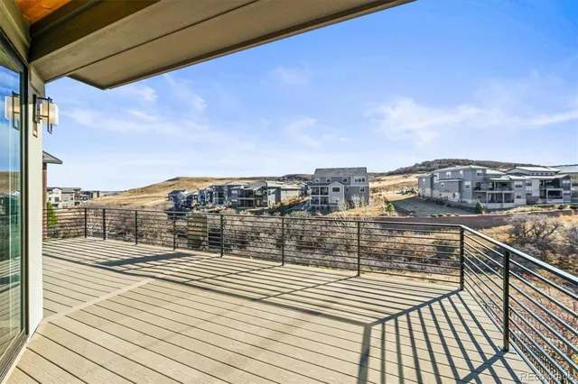 a view of a balcony with wooden floor