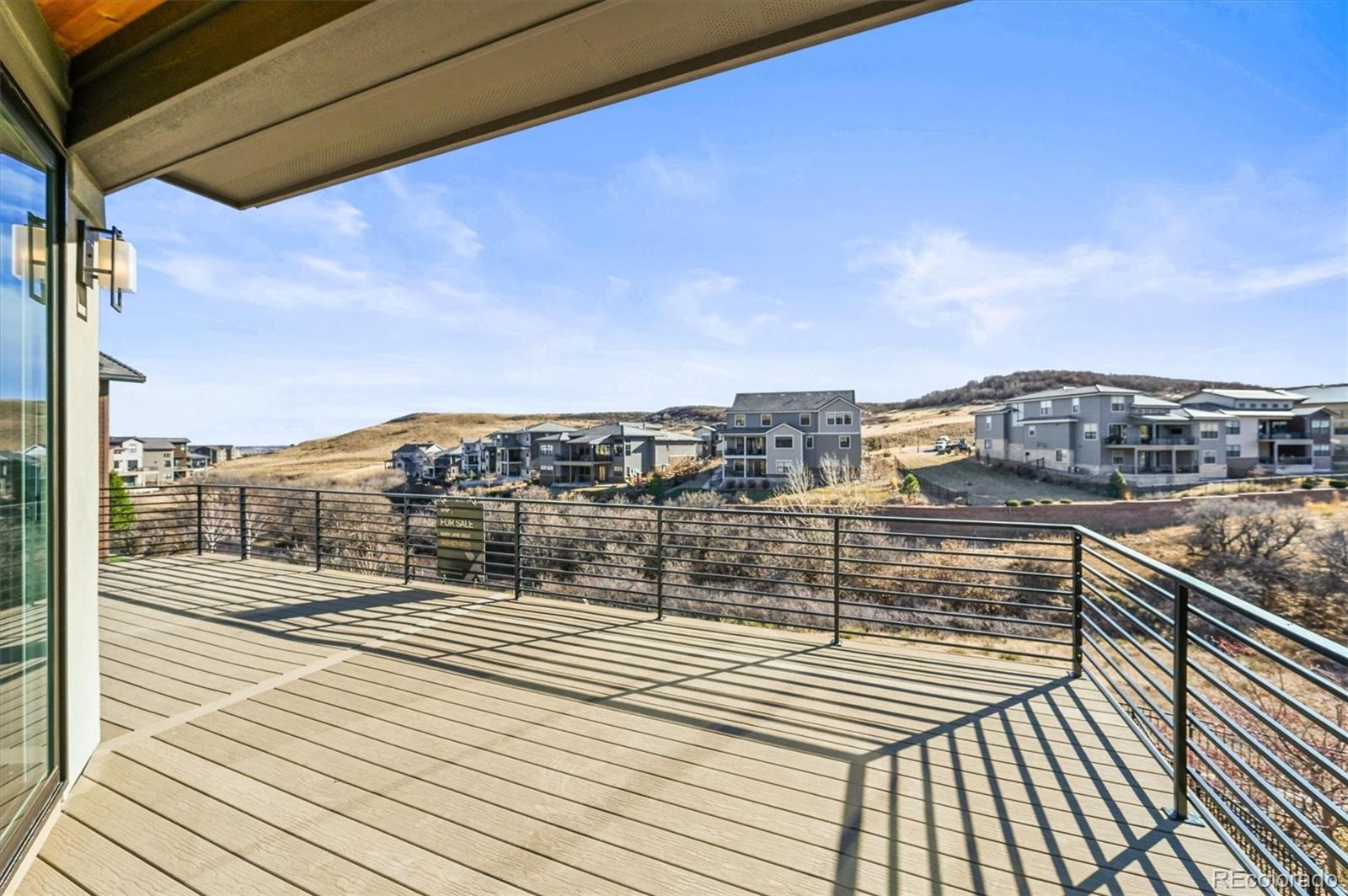 10814 Bluffside Drive Lone Tree, CO 80124 - Photo 14 of 50 a view of a balcony with wooden floor