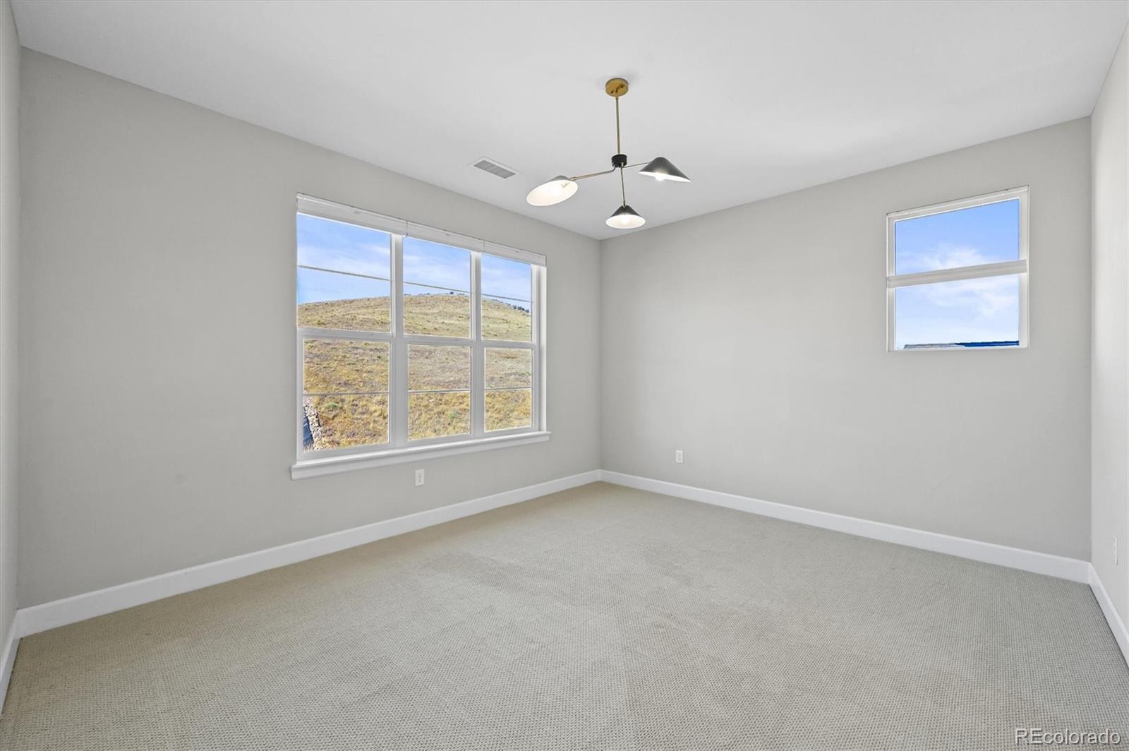 10814 Bluffside Drive Lone Tree, CO 80124 - Photo 21 of 50 wooden floor in an empty room with a window