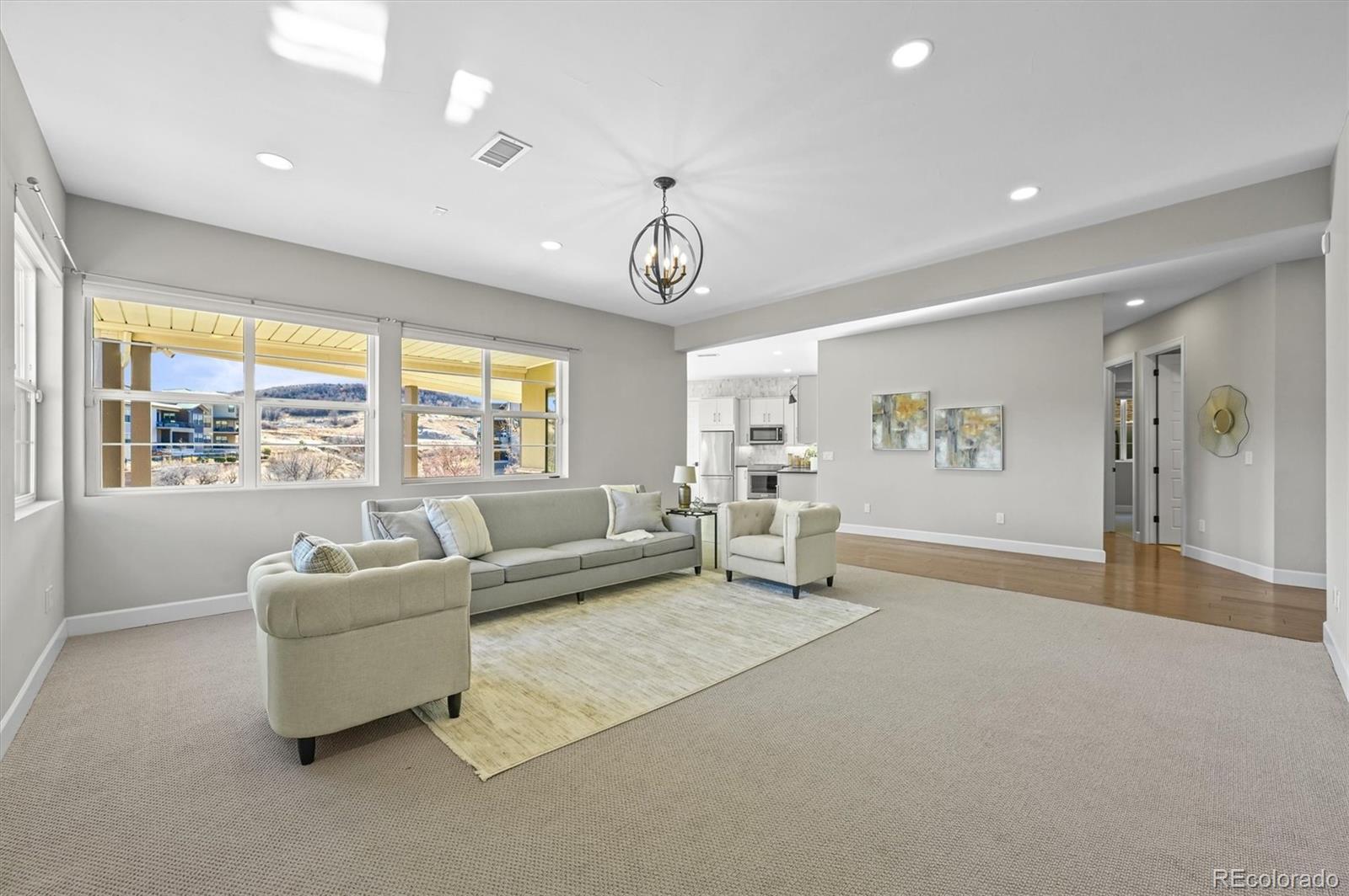 10814 Bluffside Drive Lone Tree, CO 80124 - Photo 27 of 50 a living room with furniture and a large window