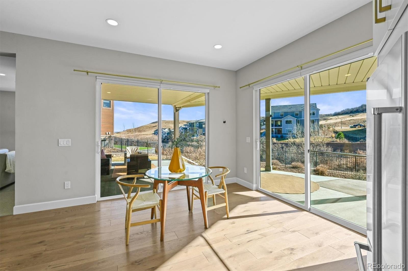 10814 Bluffside Drive Lone Tree, CO 80124 - Photo 33 of 50 a living room with furniture and floor to ceiling windows