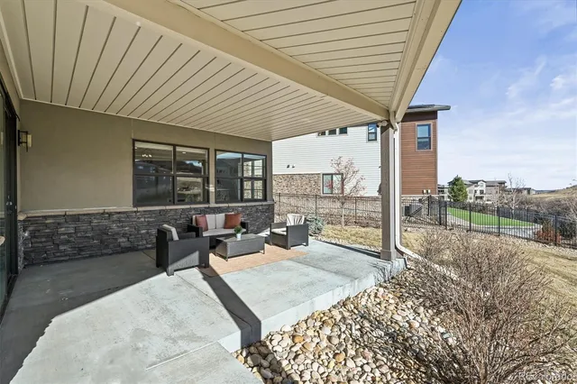 a balcony with furniture and a garden