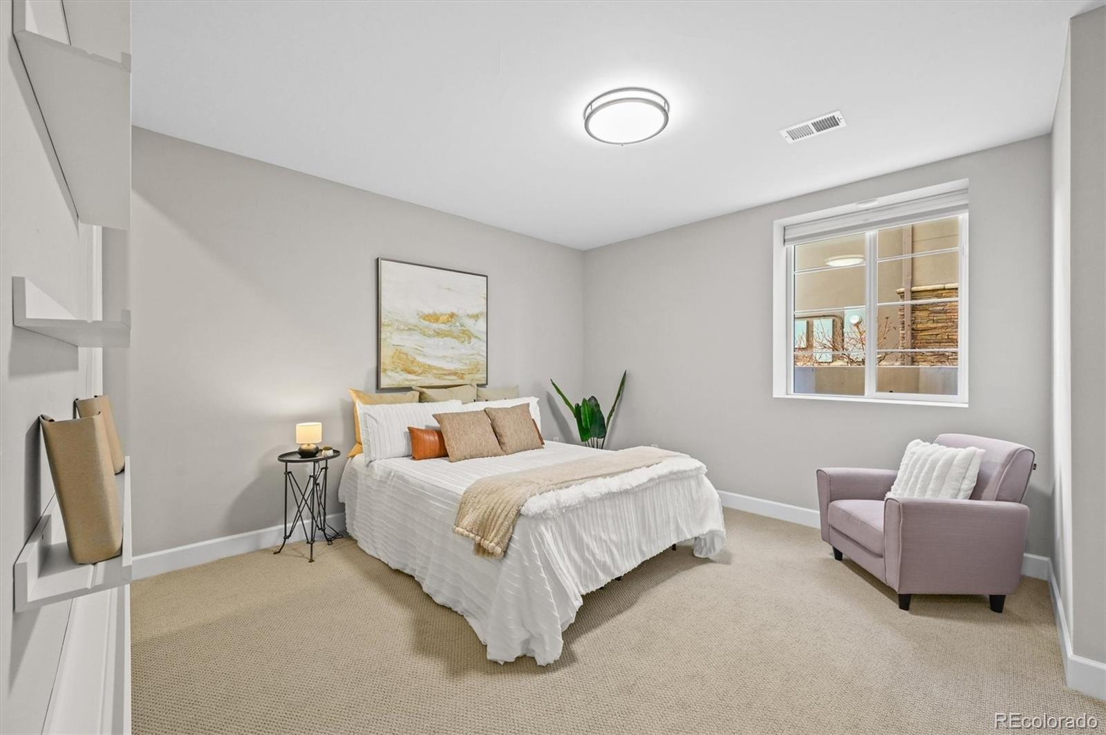 10814 Bluffside Drive Lone Tree, CO 80124 - Photo 37 of 50 a bedroom with a bed and a couch