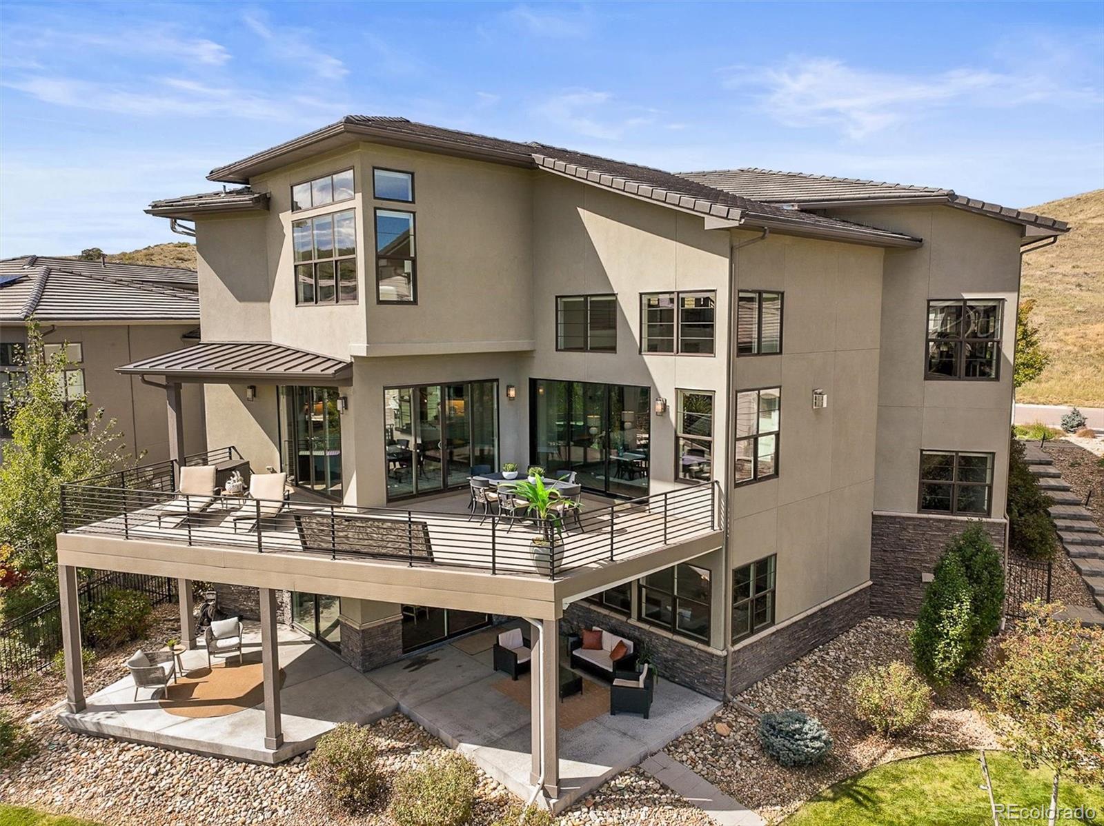 10814 Bluffside Drive Lone Tree, CO 80124 - Photo 43 of 50 a view of a house with backyard porch and sitting area