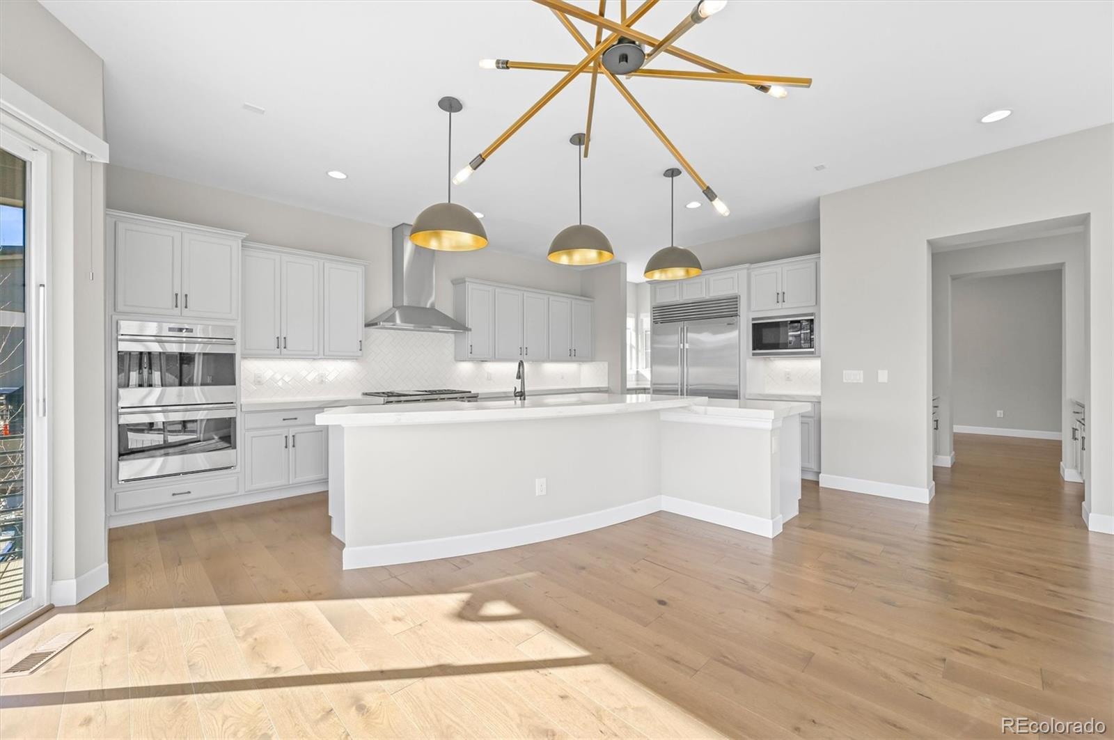 10814 Bluffside Drive Lone Tree, CO 80124 - Photo 7 of 50 a view of kitchen with wooden floor