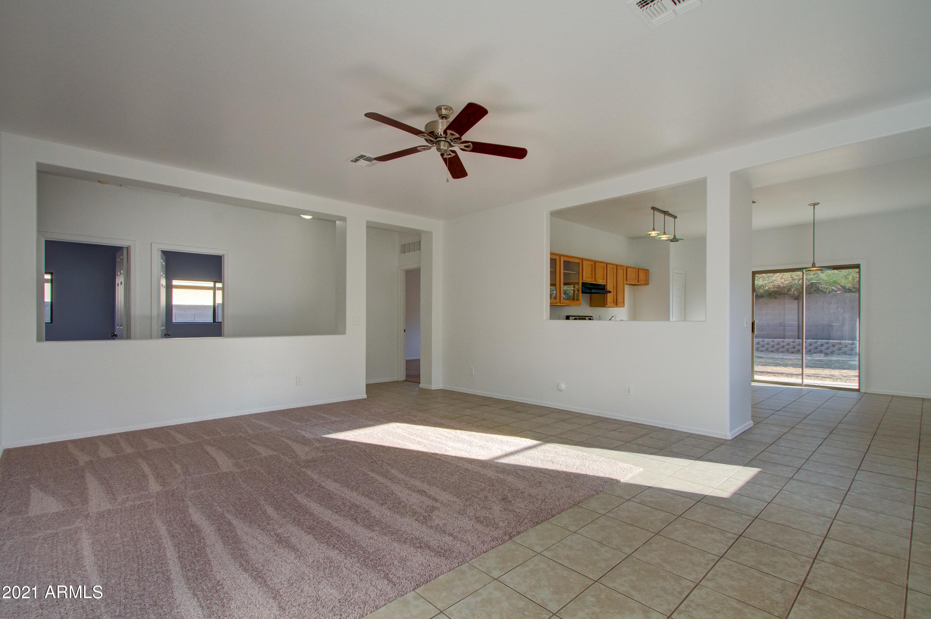 913 East Pedro Road Phoenix, AZ 85042 - Photo 3 of 15 003_living Room To Kitchen
