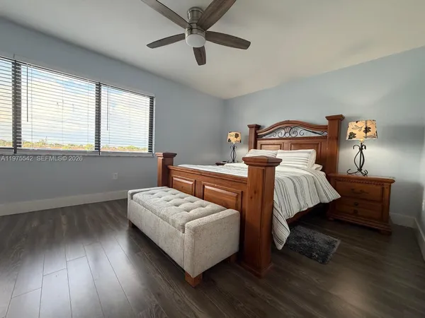 a bathroom with a sink toilet and mirror