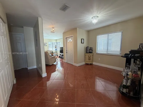 a bedroom with a bed and a ceiling fan