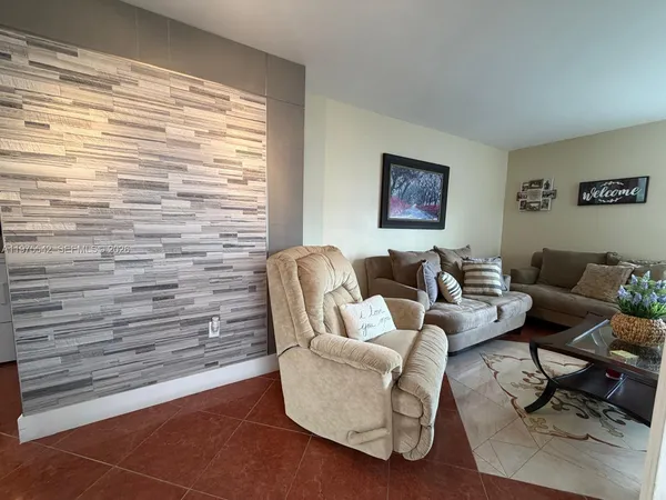 a bedroom with a bed and a mirror