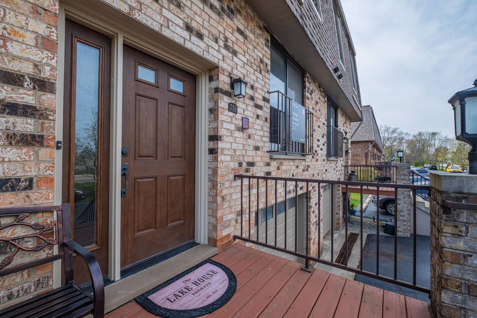 759 North Old Rand Road Lake Zurich, IL 60047 - Photo 2 of 34 a view of a balcony with furniture and wooden floor