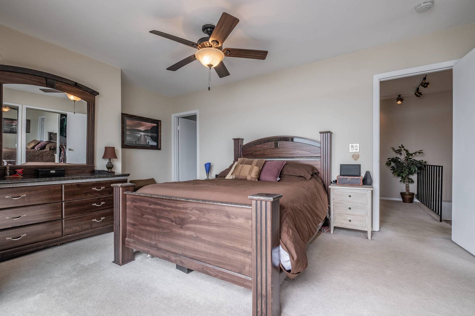 759 North Old Rand Road Lake Zurich, IL 60047 - Photo 17 of 34 a bedroom with a bed and a chandelier