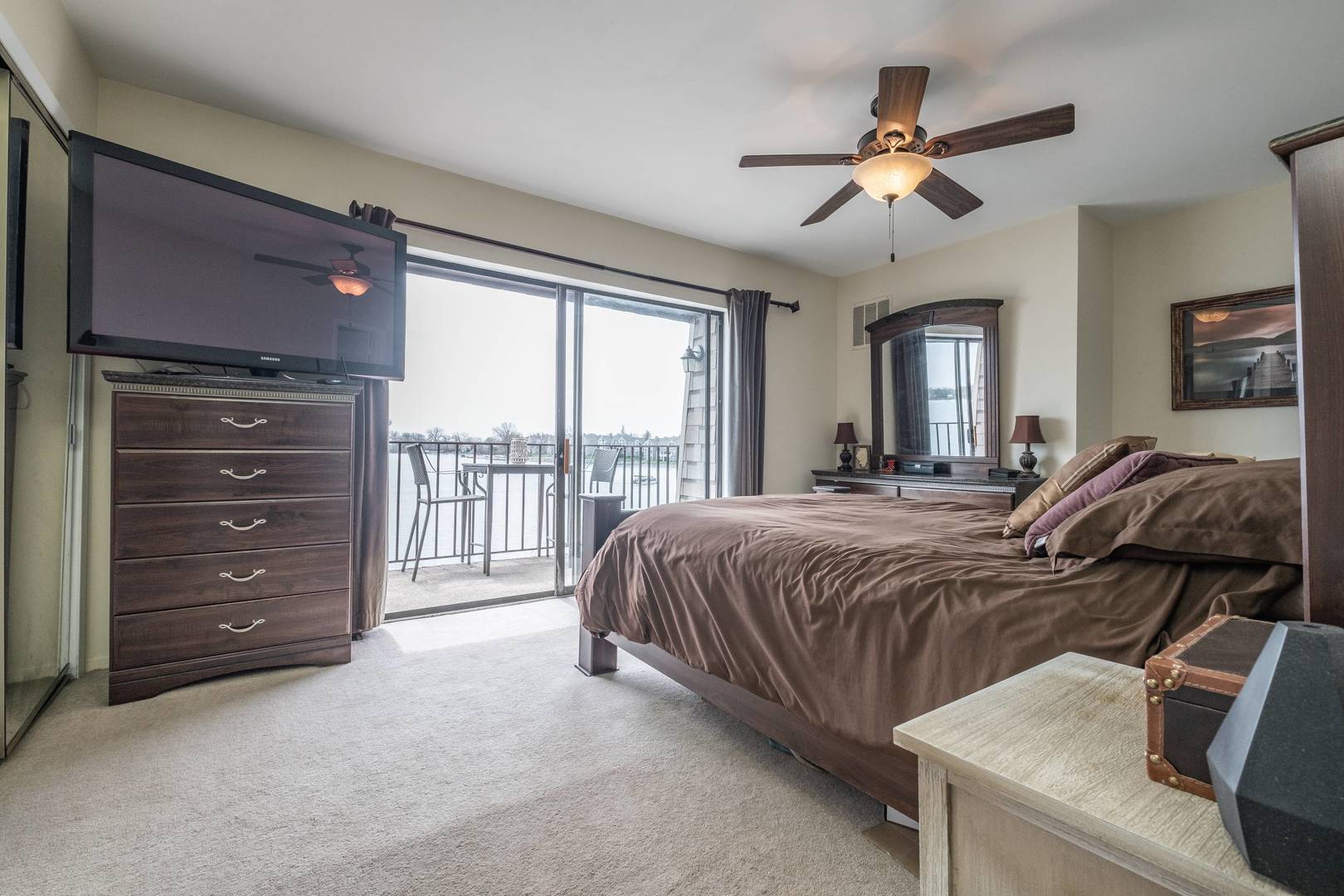 759 North Old Rand Road Lake Zurich, IL 60047 - Photo 18 of 34 a spacious bedroom with a bed and a ceiling fan