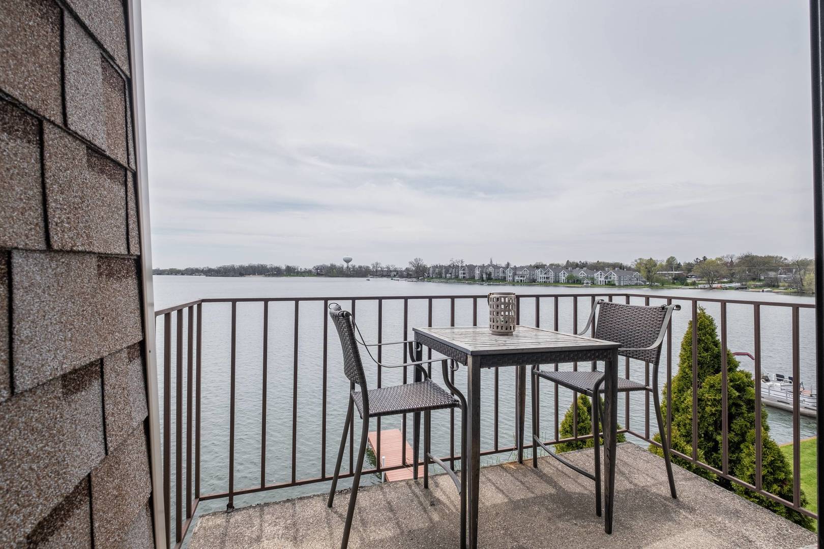 759 North Old Rand Road Lake Zurich, IL 60047 - Photo 19 of 34 a view of a balcony with wooden chairs and floor