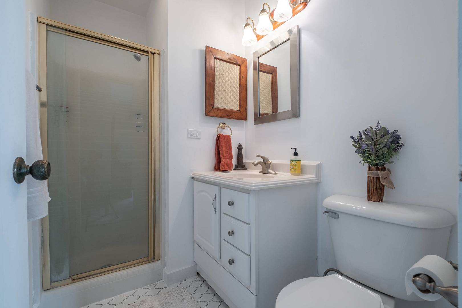 759 North Old Rand Road Lake Zurich, IL 60047 - Photo 20 of 34 a bathroom with a toilet a sink a mirror a vanity and shower