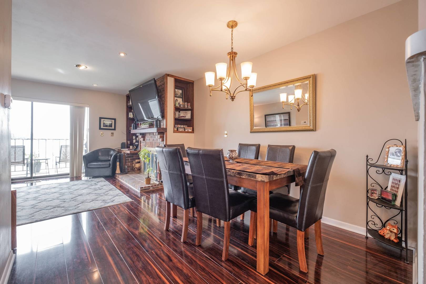 759 North Old Rand Road Lake Zurich, IL 60047 - Photo 3 of 34 a view of a dining room with furniture a chandelier and wooden floor
