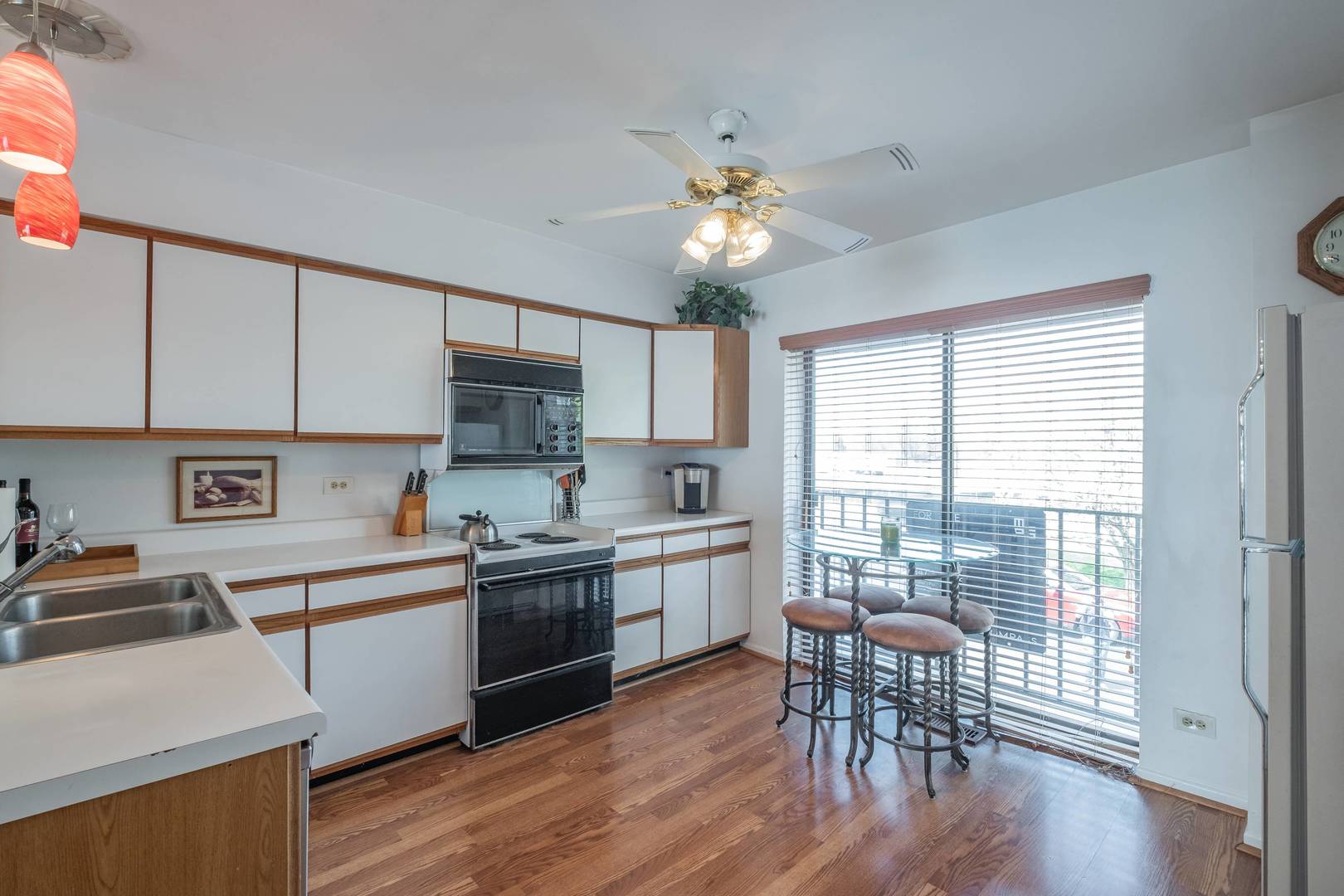 759 North Old Rand Road Lake Zurich, IL 60047 - Photo 27 of 34 a kitchen with a table chairs sink and cabinets