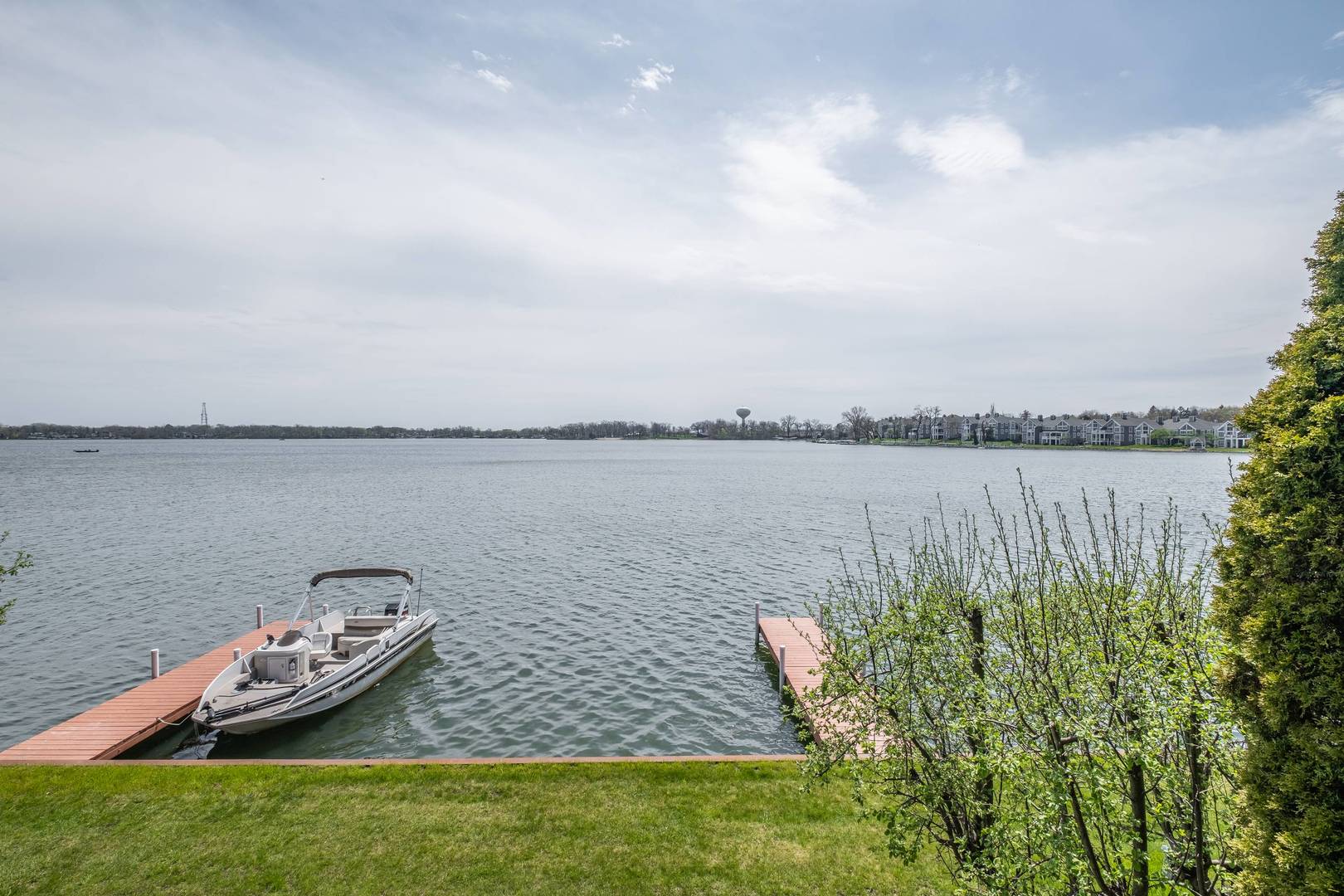 759 North Old Rand Road Lake Zurich, IL 60047 - Photo 30 of 34 a view of a lake with a big yard and large trees