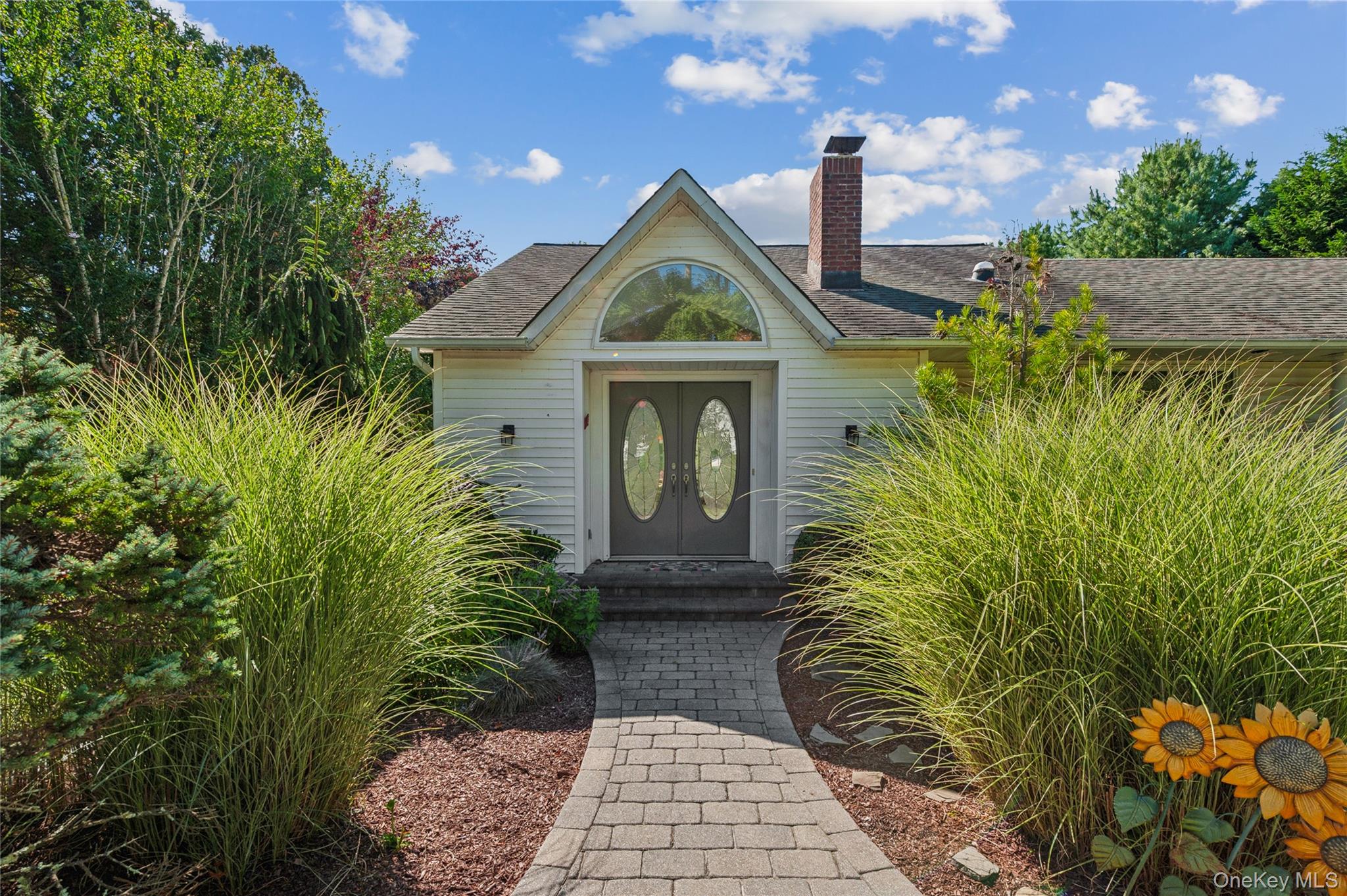 35 Halsey Road Remsenburg, NY 11960 - Photo 1 of 17 a front view of a house with garden