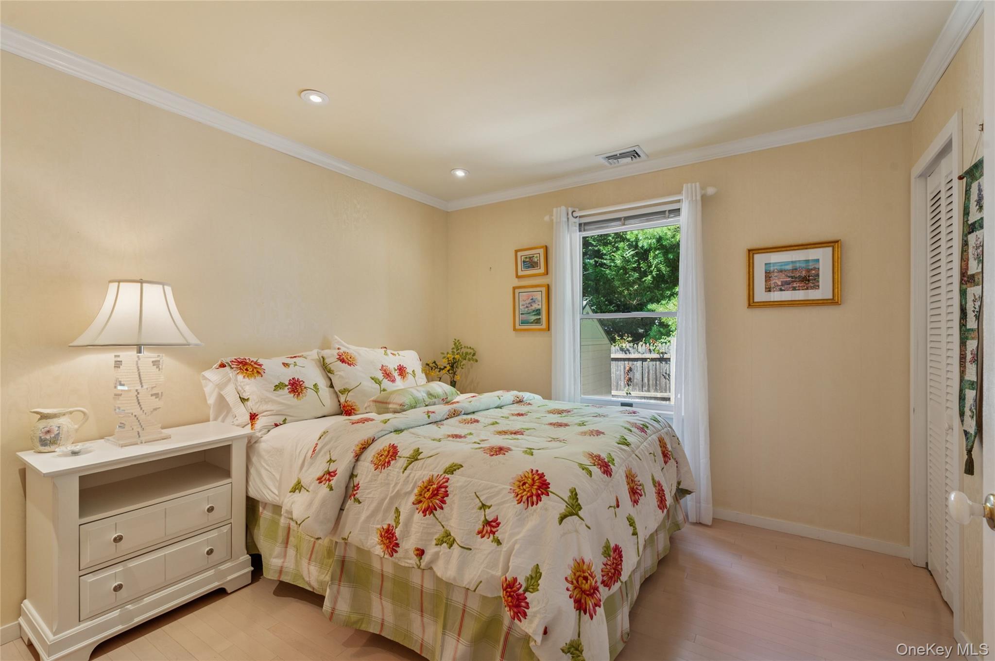 35 Halsey Road Remsenburg, NY 11960 - Photo 11 of 17 a bedroom with a bed and a window