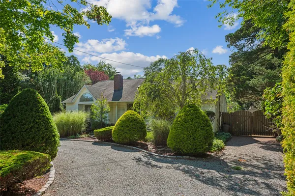 a view of a pathway both side of house