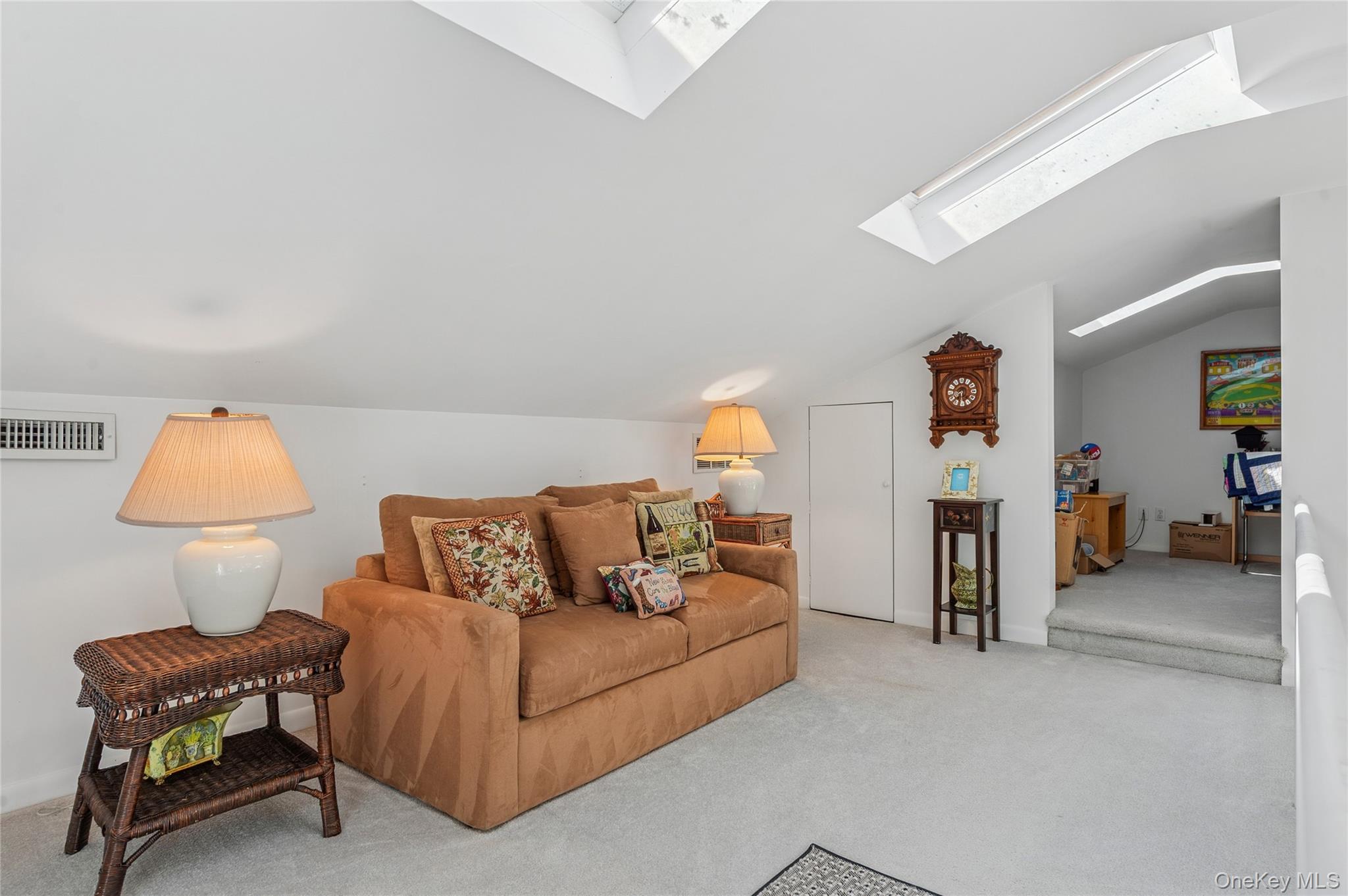 35 Halsey Road Remsenburg, NY 11960 - Photo 3 of 17 a living room with furniture and a lamp