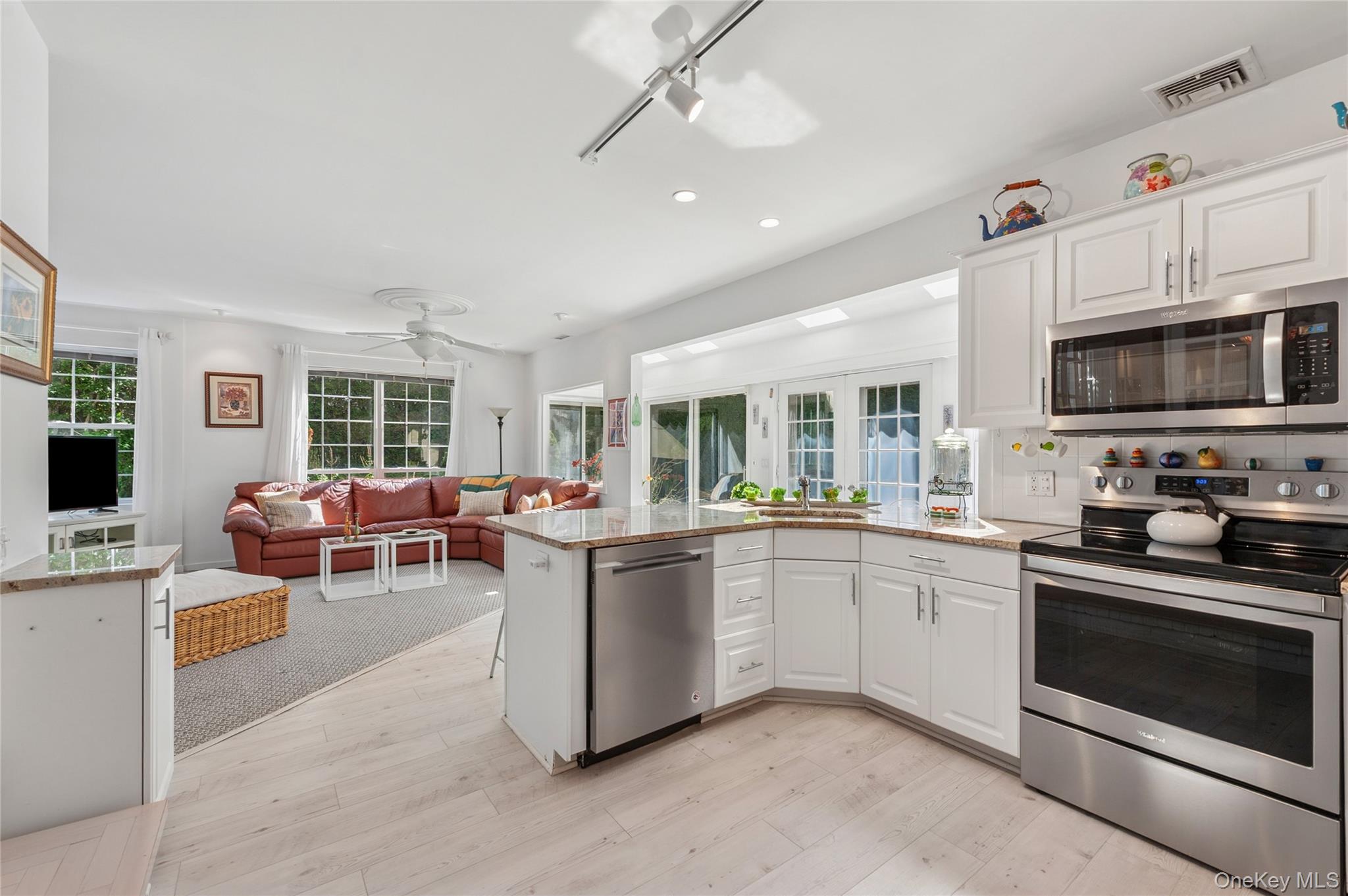 35 Halsey Road Remsenburg, NY 11960 - Photo 5 of 17 a kitchen with furniture a stove and a window