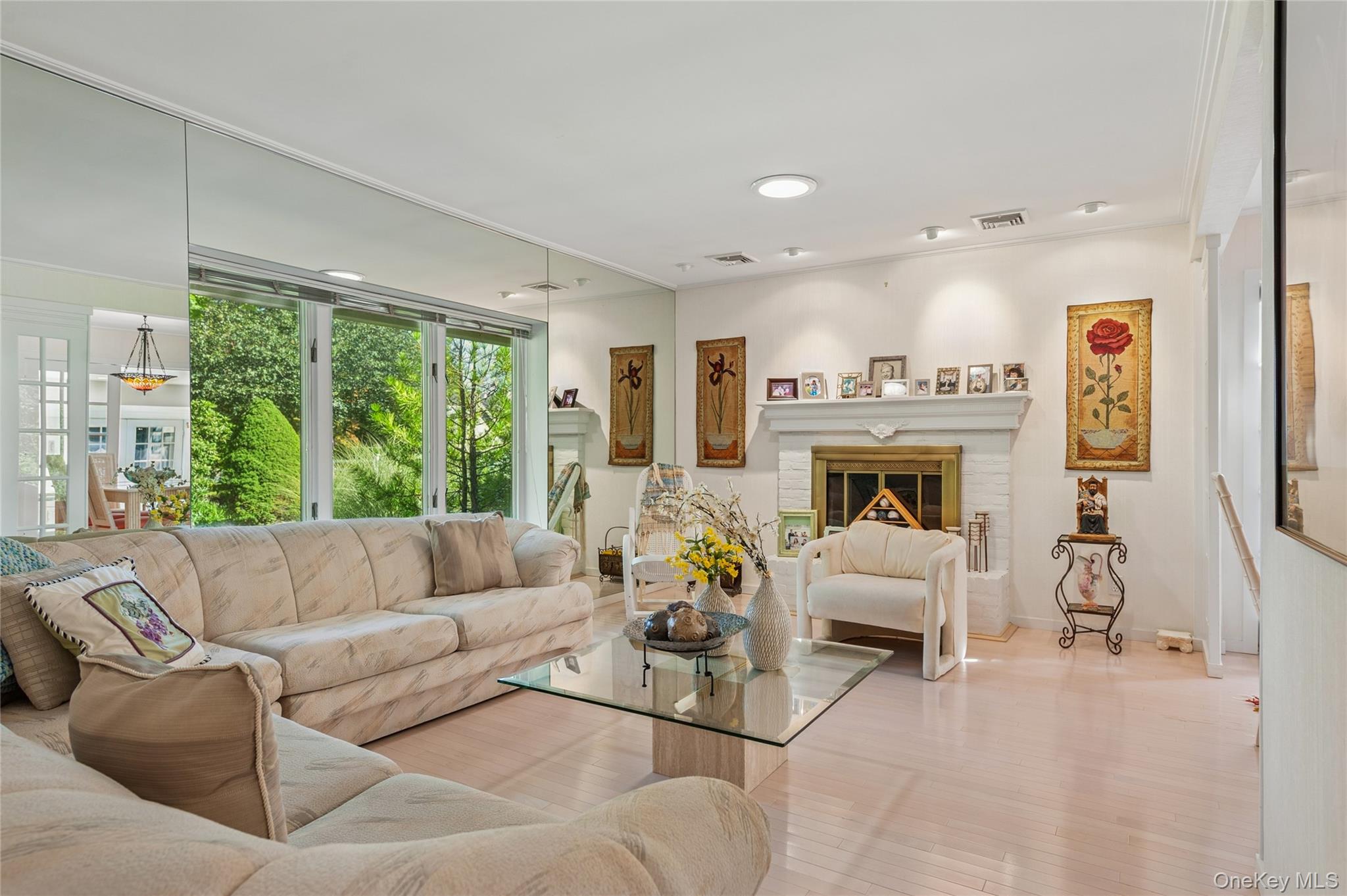 35 Halsey Road Remsenburg, NY 11960 - Photo 10 of 17 a living room with furniture large window and a fireplace