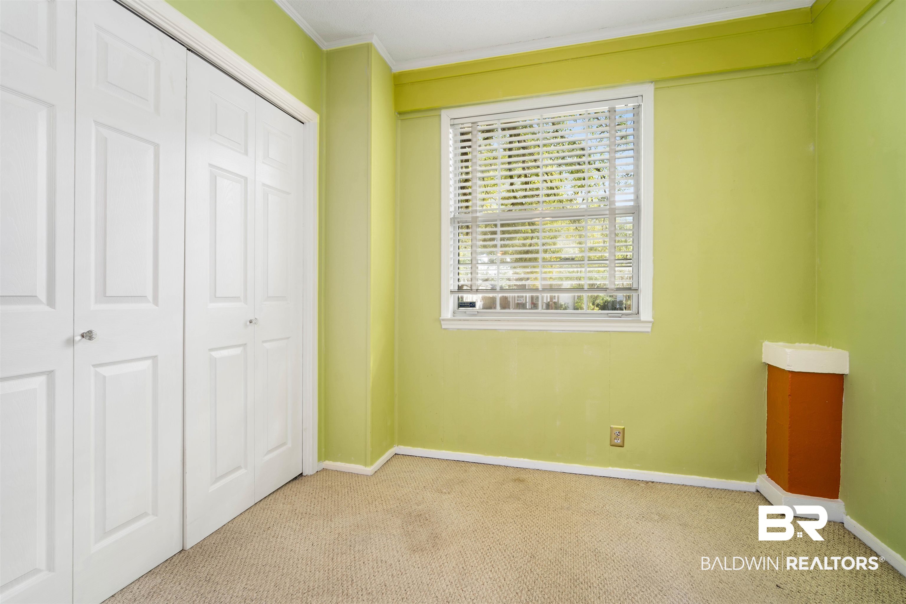 118 Mohawk Street Mobile, AL 36606 - Photo 13 of 26 Unfurnished bedroom with ornamental molding, light colored carpet, and a closet