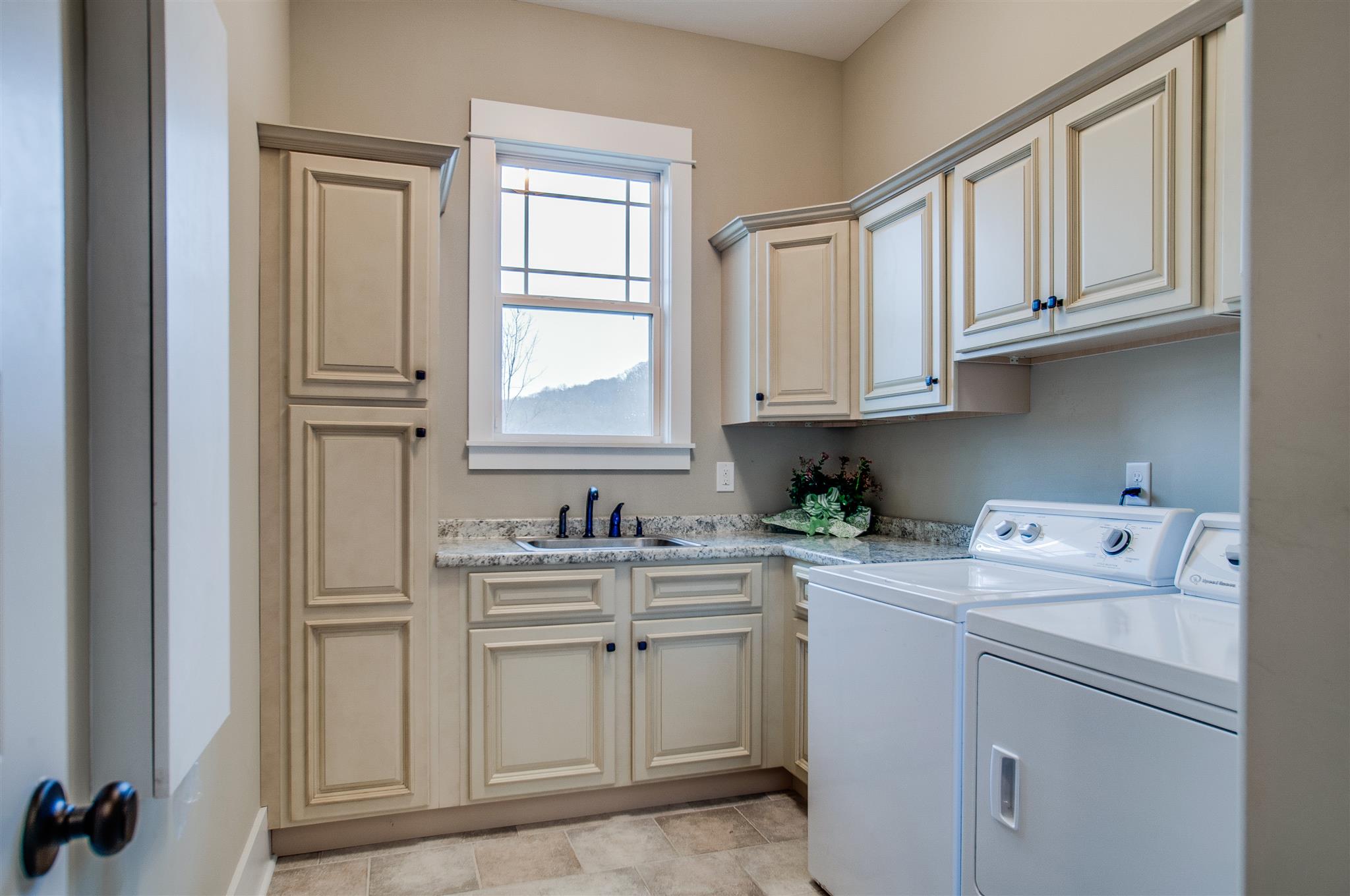 2533 Belle Brook Drive Franklin, TN 37067 - Photo 16 of 30 a view of cabinets a washer and dryer